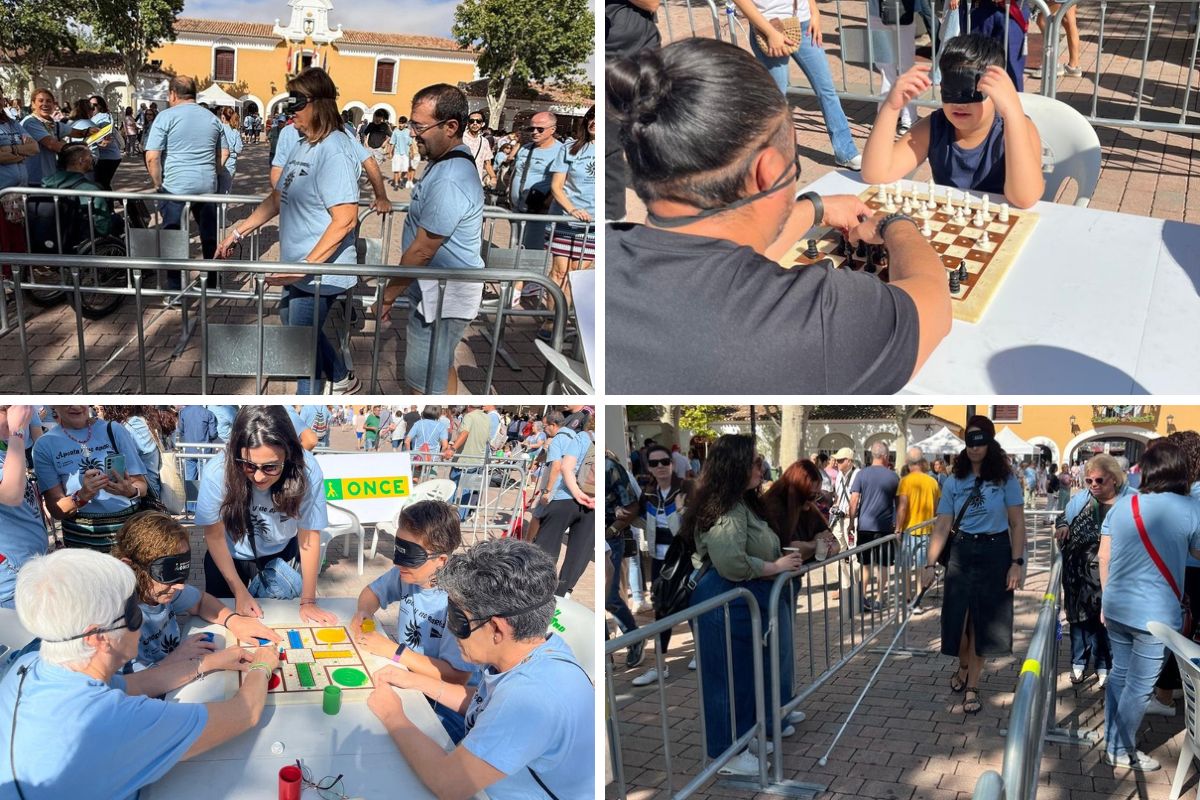 Participantes en el stand de la ONCE durane el Día de la Discapacidad en la feria con el antifaz probando el bastón y diferentes juegos de mesa accesibles