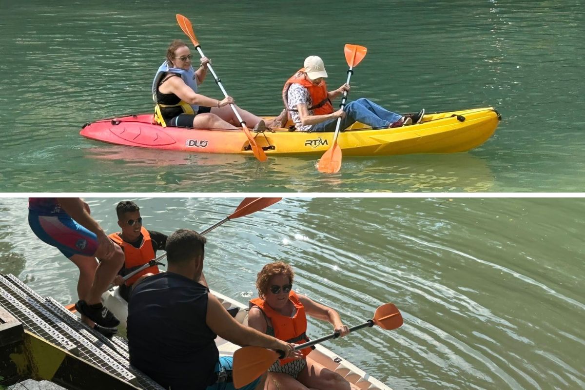 Participantes remando en la piragua y subiendo a ella desde el embarcadero con la ayuda de los técnicos del club